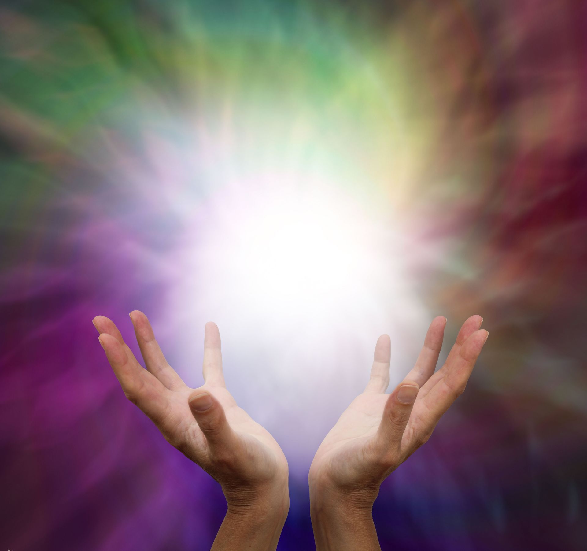 A person is holding a light in their hands