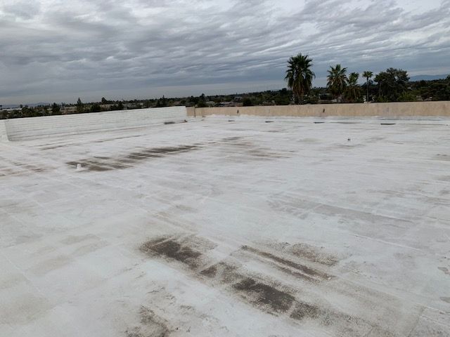 Before commercial building foam roof replacement