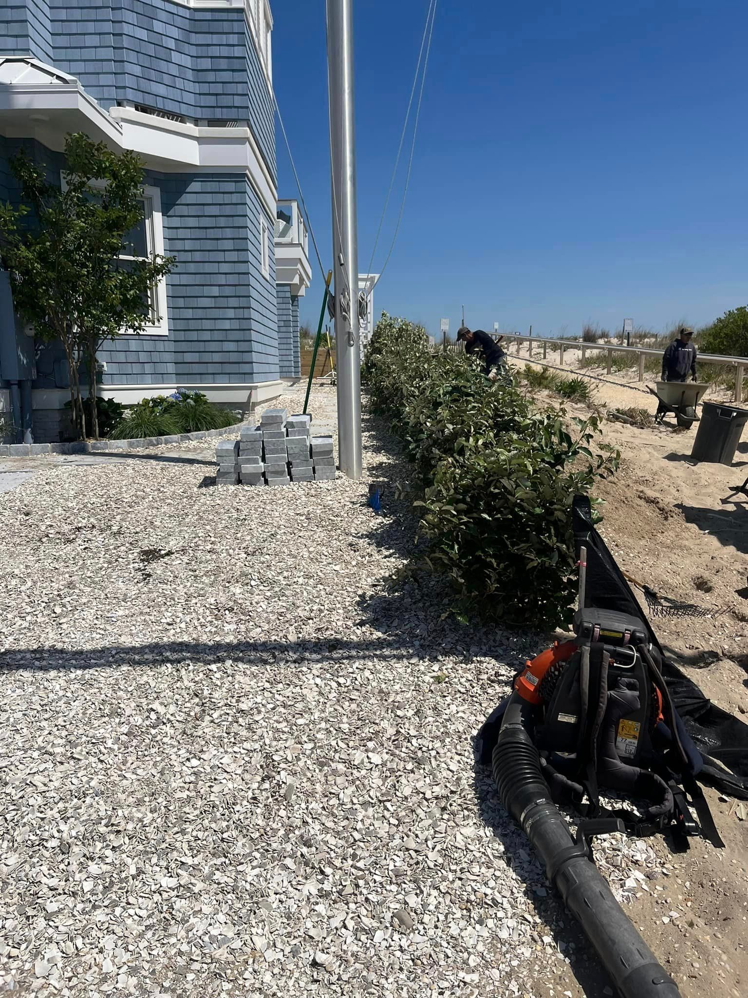 A house with a flag pole in front of it is being built.
