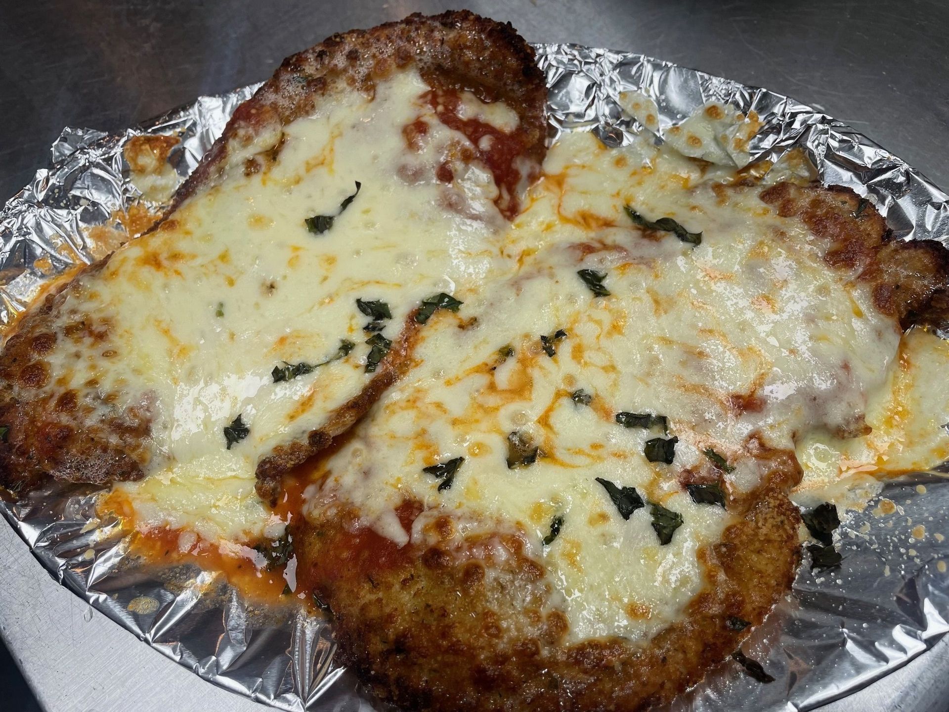 A close up of a plate of food with cheese on it.