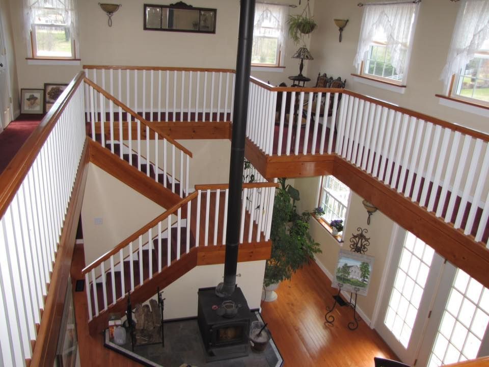 A room with stairs and a fireplace in it