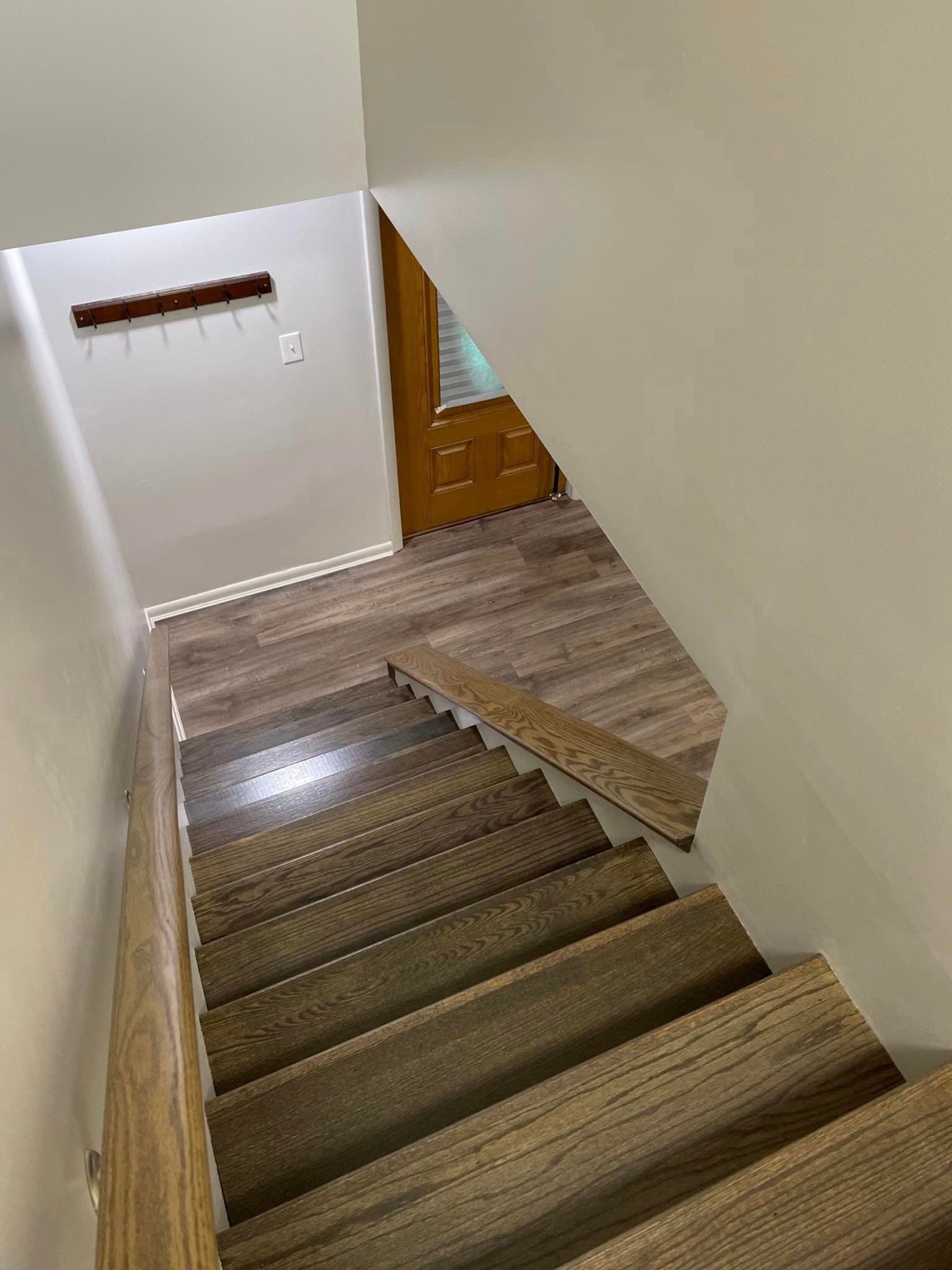 A set of stairs leading up to the second floor of a house.