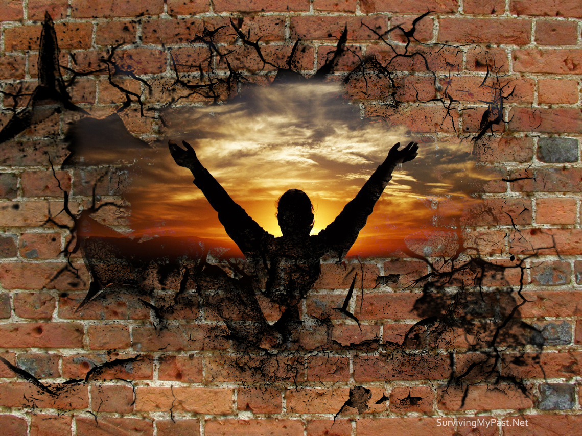 a brick wall with a silhouette of a person with their arms outstretched