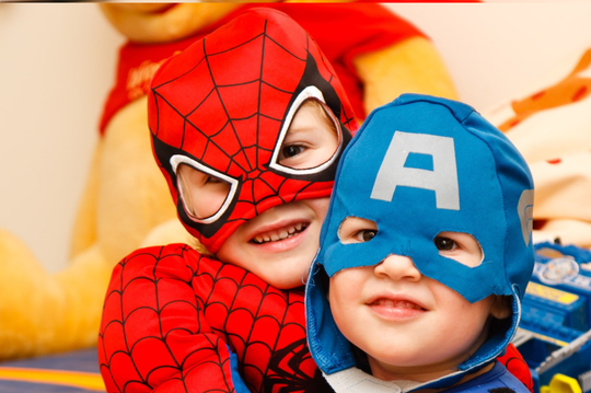 Kids in Spiderman and Captain America costumes