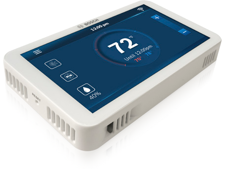 A thermostat with a screen that says 72 degrees on it