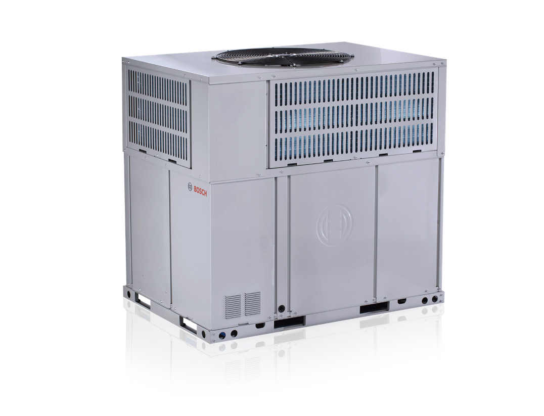 A white air conditioner is sitting on top of a white surface