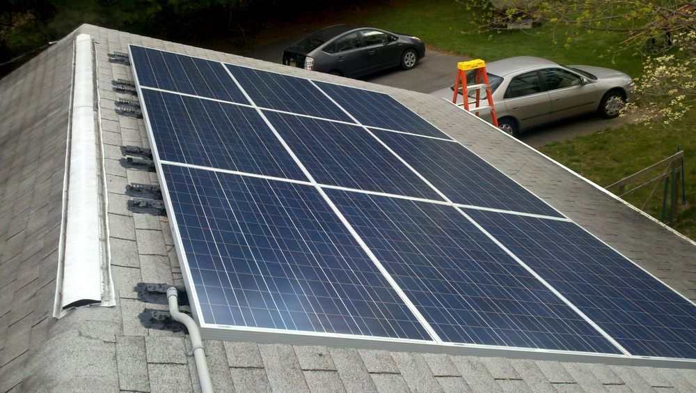 A roof with a lot of solar panels on it.