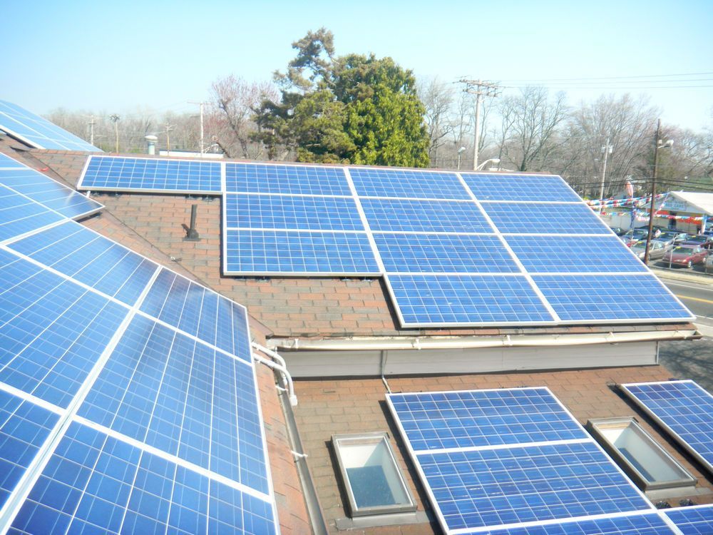 A roof with a lot of solar panels on it.