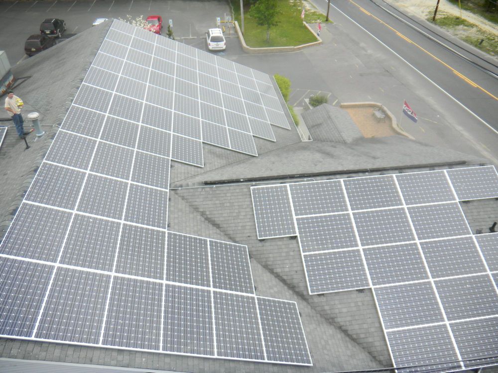 A roof with a lot of solar panels on it.