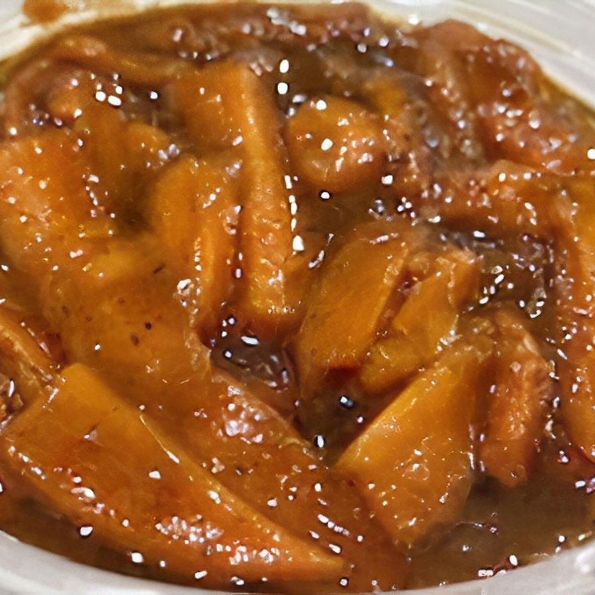 A close-up of a candied yams