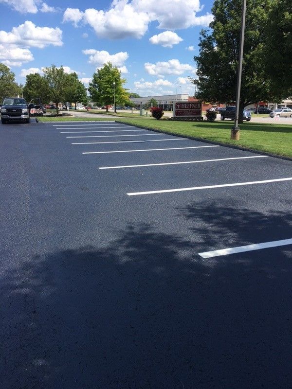 A parking lot with a lot of cars parked in it