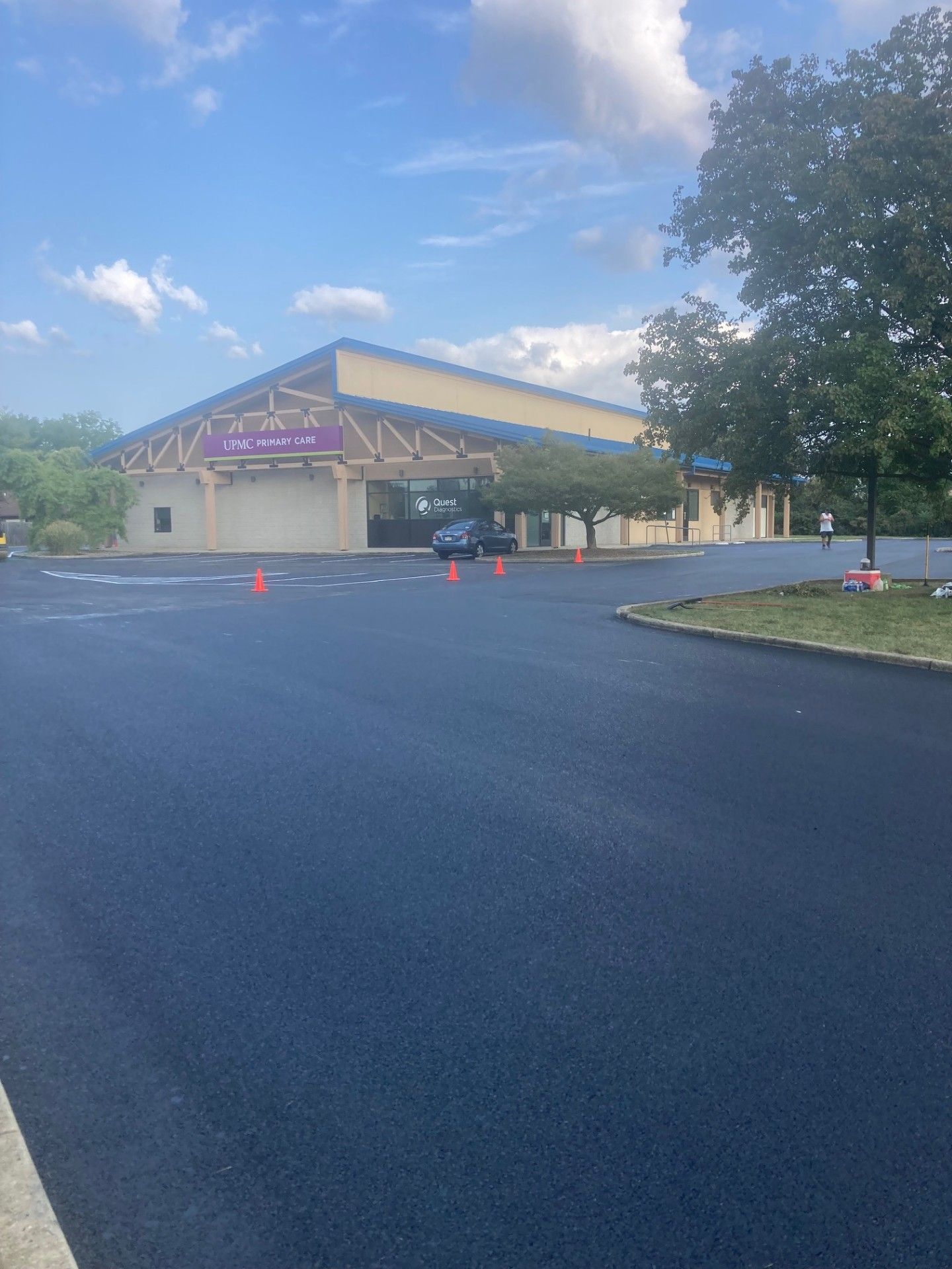 A large building with a parking lot in front of it.