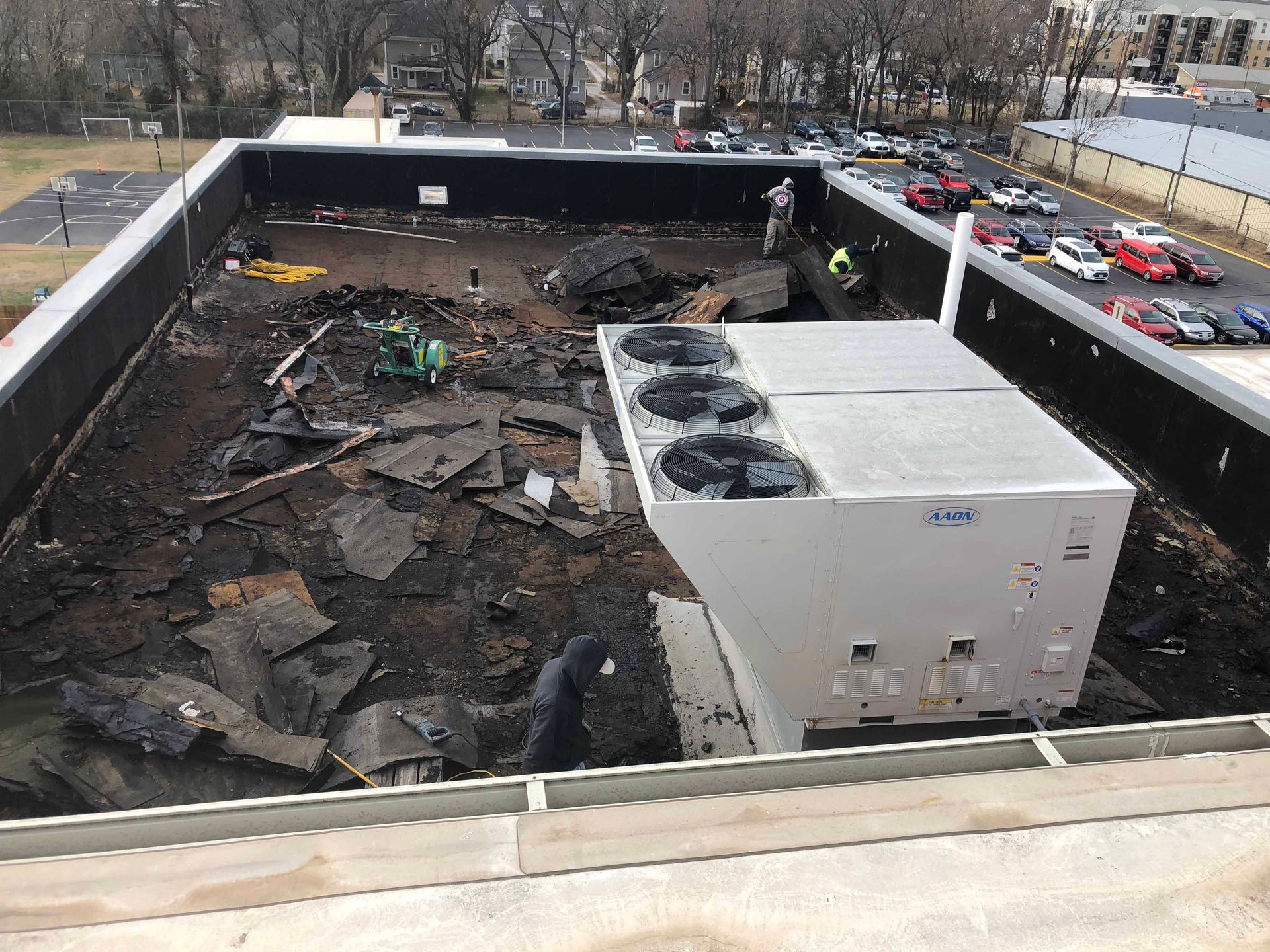 The roof of a building is being demolished.