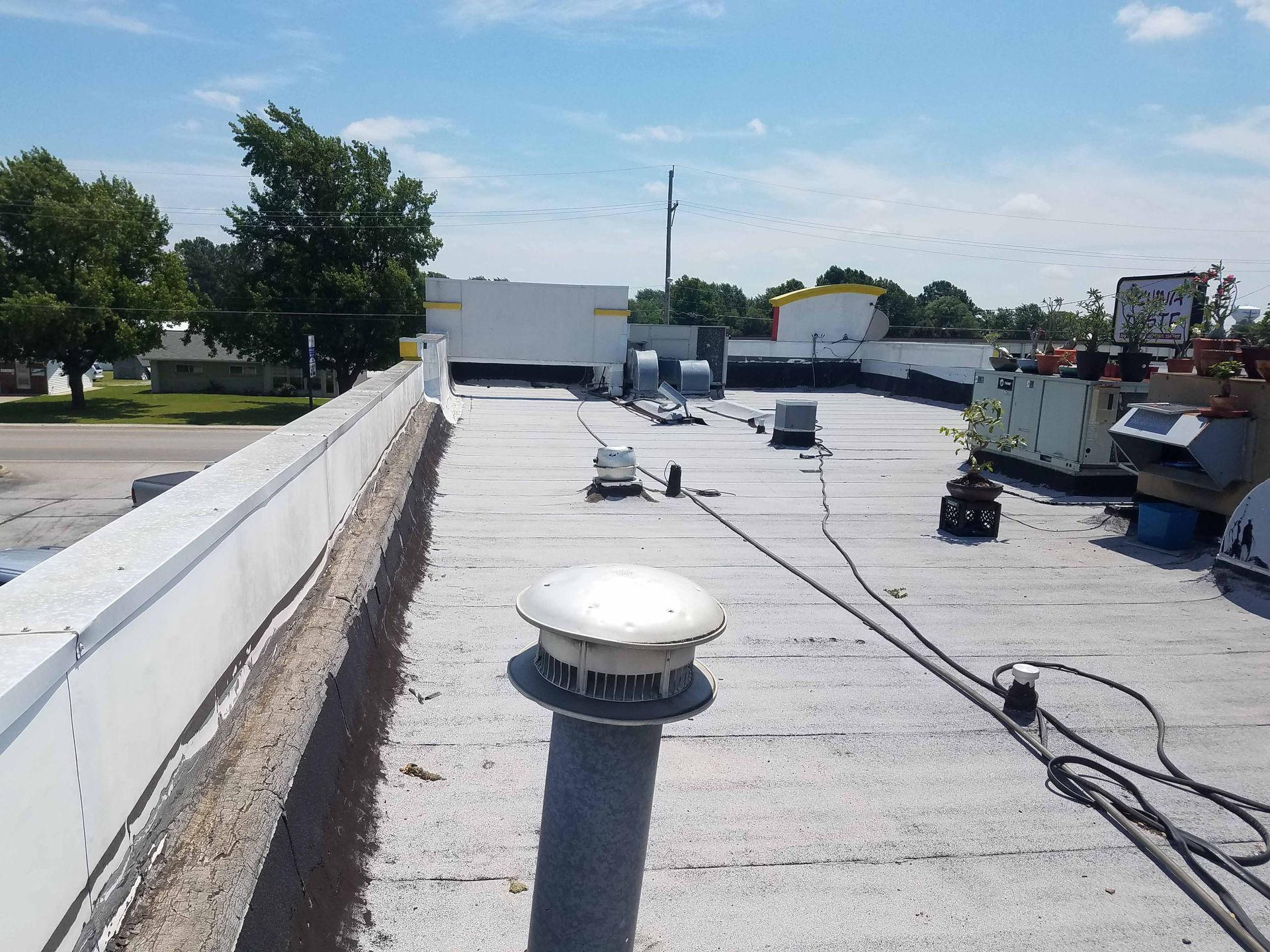The roof of a building with a chimney on it