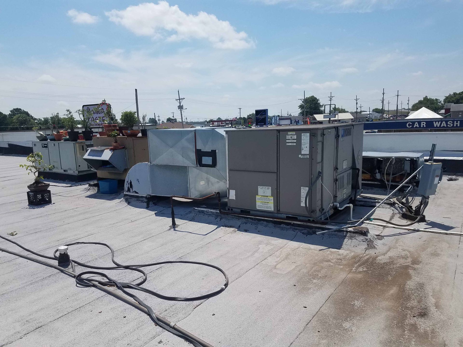 A roof with a lot of electrical equipment on it