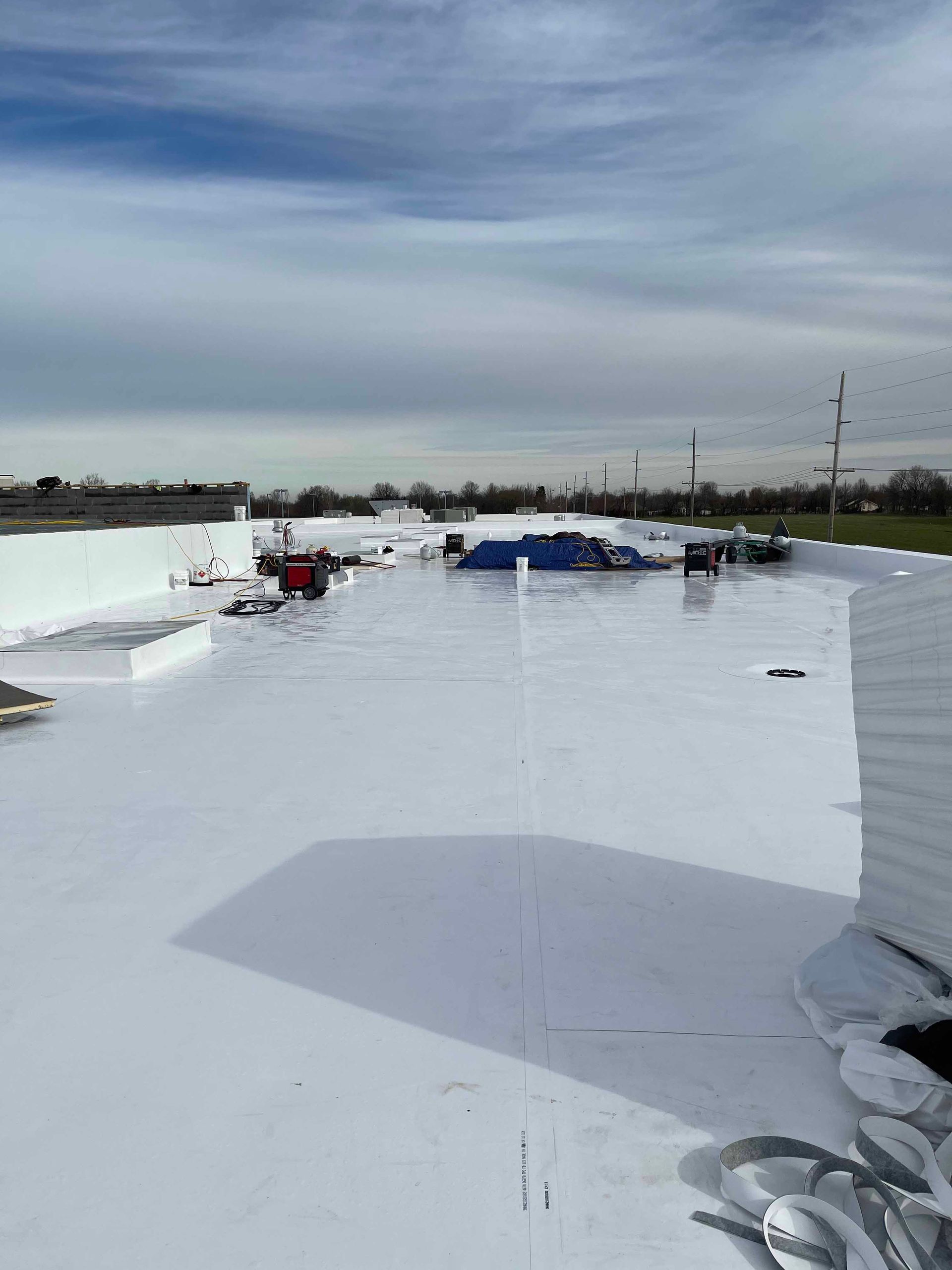 A white roof with a blue sky in the background.