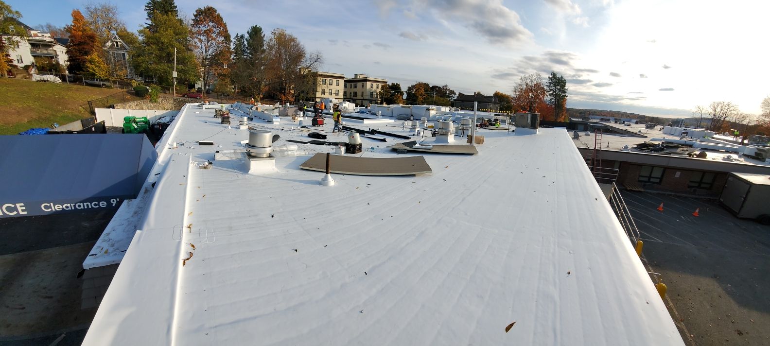 A white roof is being installed on top of a building.