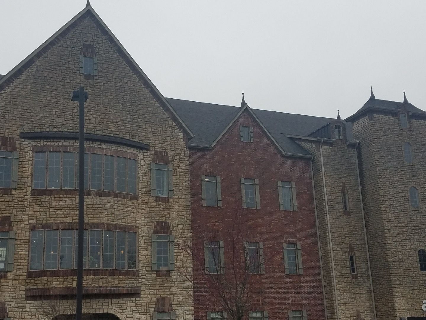 A large stone building with a clock on top of it