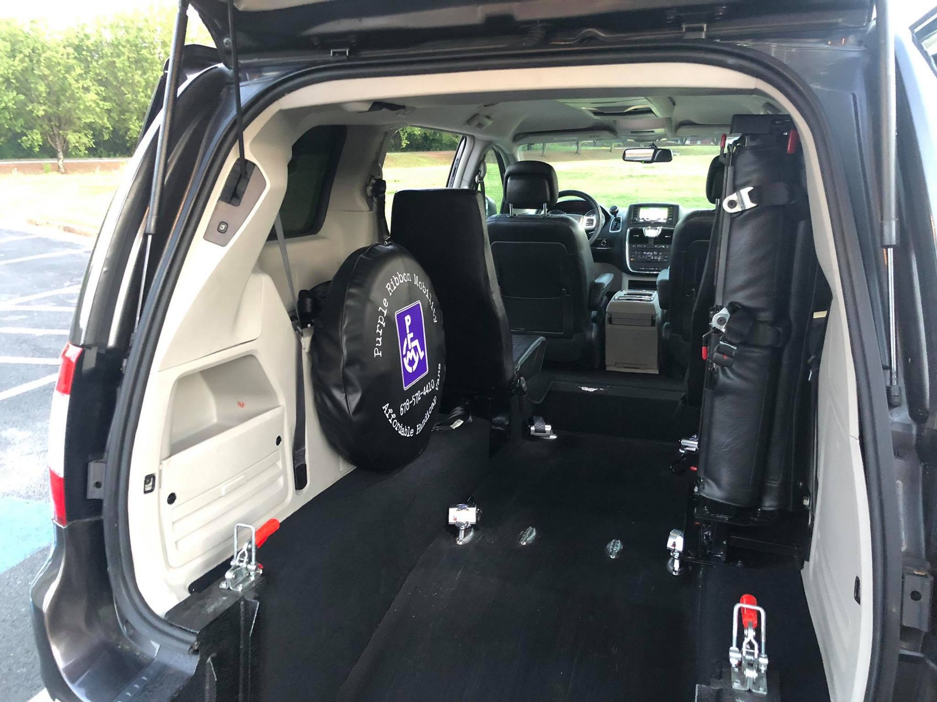 Interior view of a handicap-accessible van with rear-entry ramp.