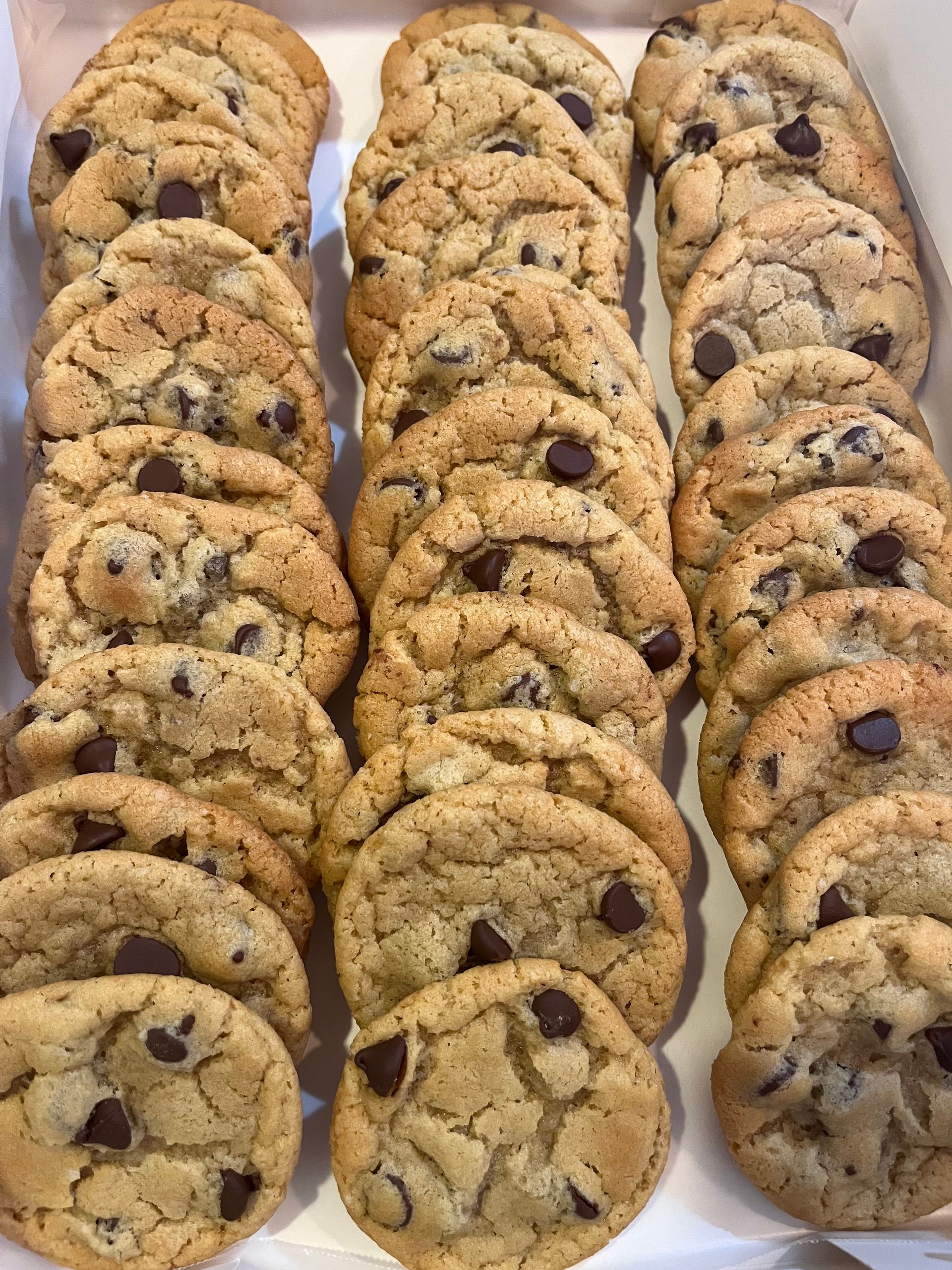 a box of chocolate chip cookies is sitting on a table