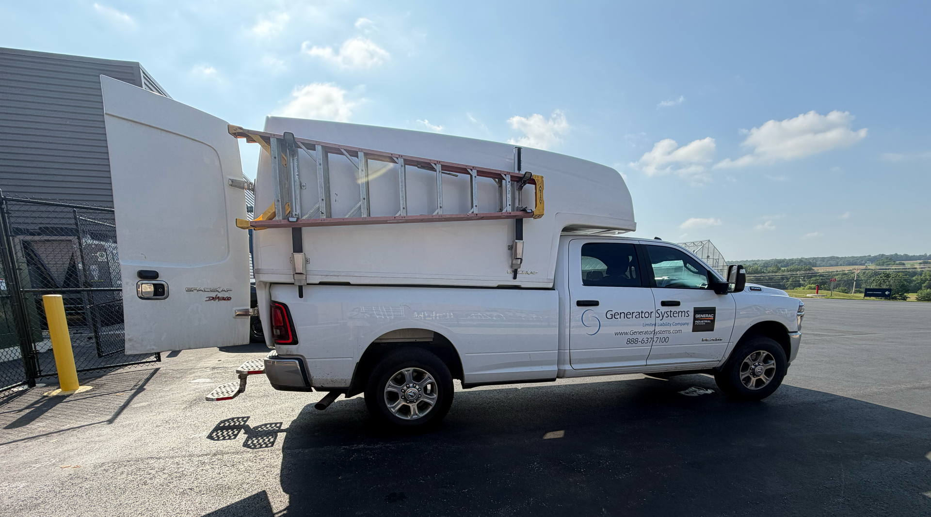 White utility truck with ladder rack parked outside a building, with “Always Ready” text overlay.