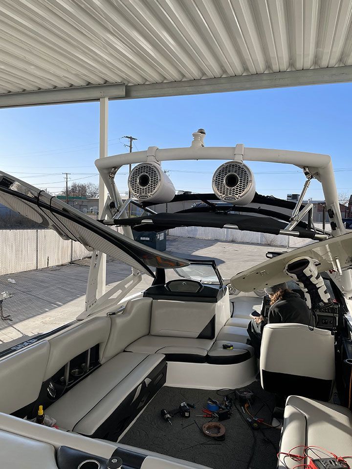 The inside of a boat with speakers on top of it