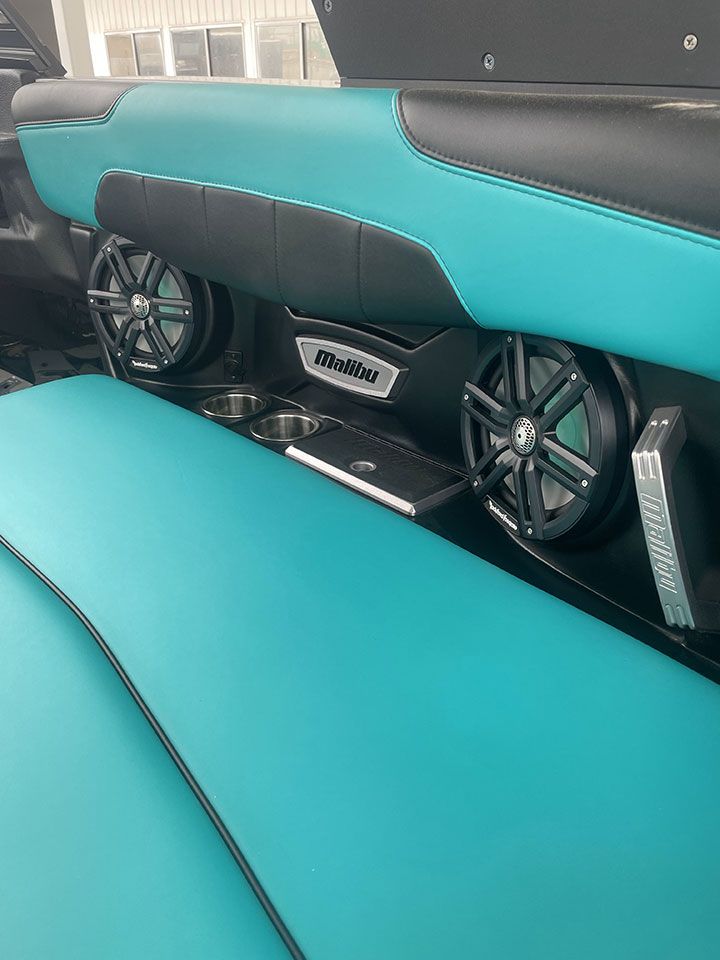 The back of a boat with speakers on it