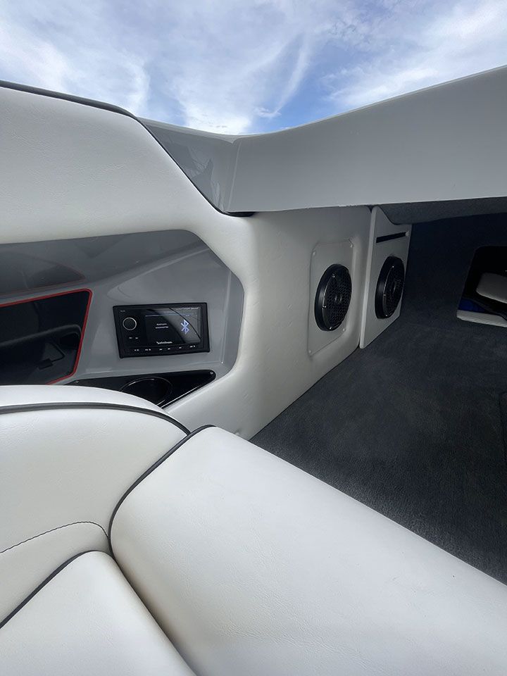 The inside of a boat with speakers and a radio