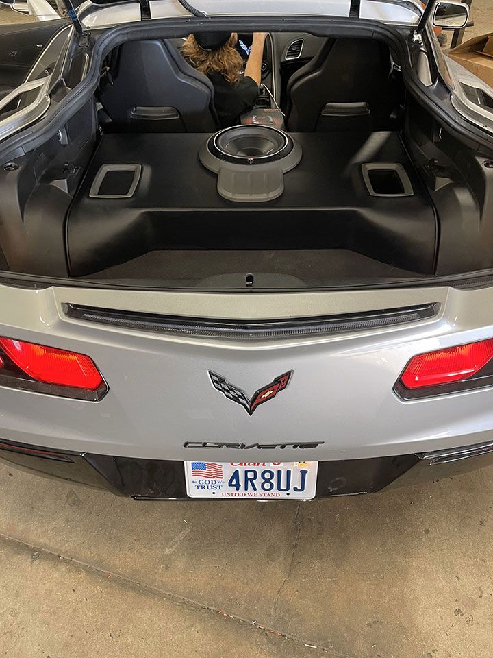 The back of a silver Corvette