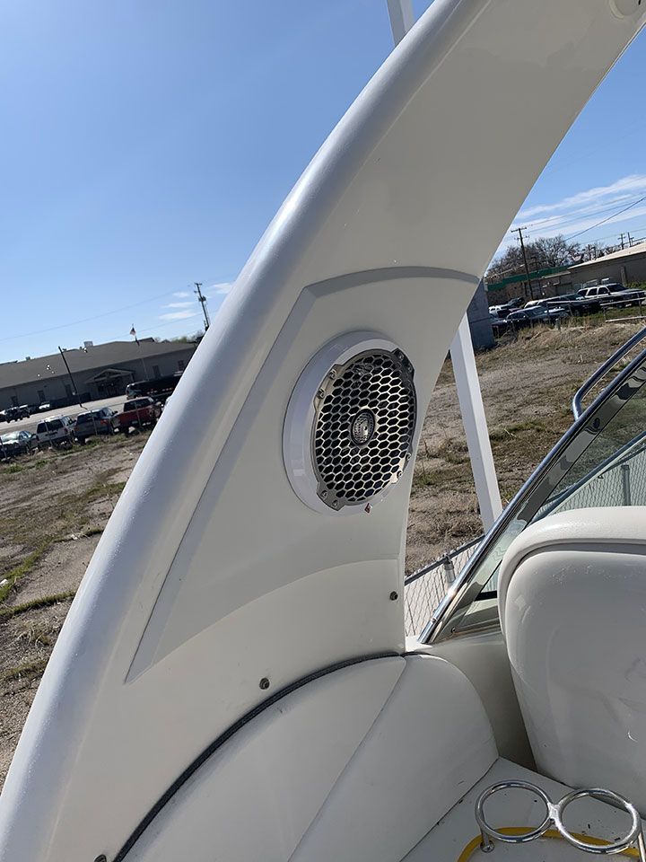 A boat with a speaker on the side of it