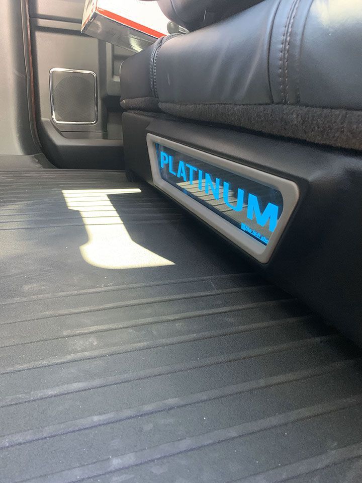 The word platinum is on the side of a car