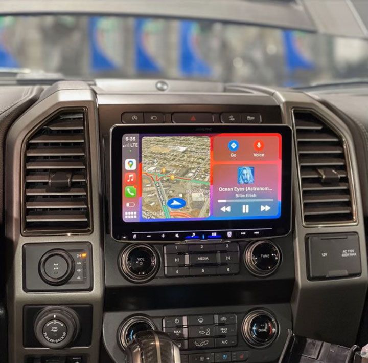 A car dashboard with a screen showing GPS