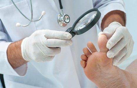 Doctor examines the foot