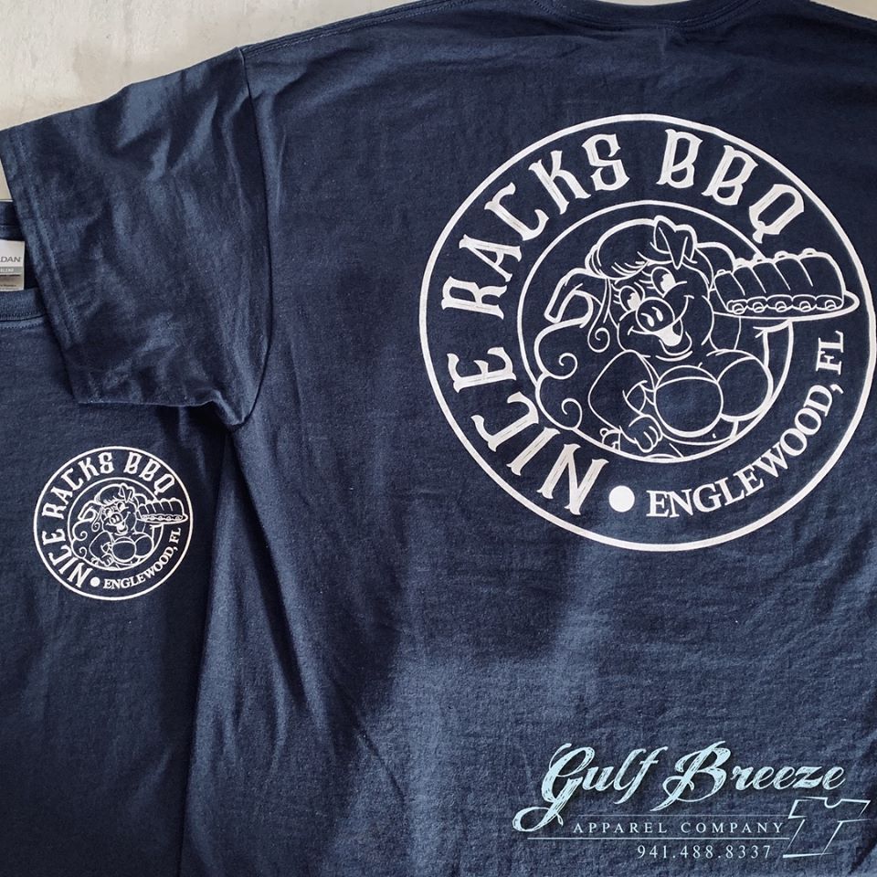 Dark navy t-shirt with a white “Joe Racks BBQ” circular logo and “Gulf Breeze” text.