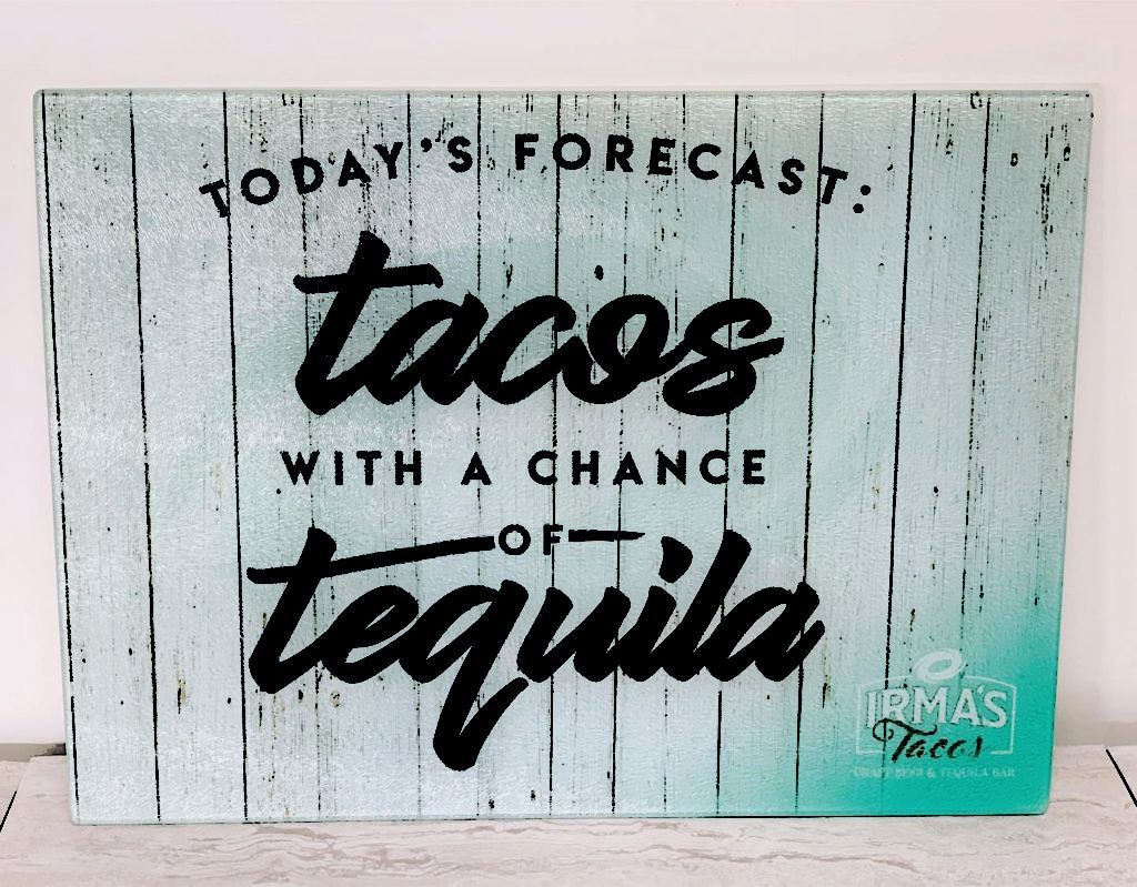 Wood sign reading “Today’s forecast: tacos with a chance of tequila” on a white wood background.