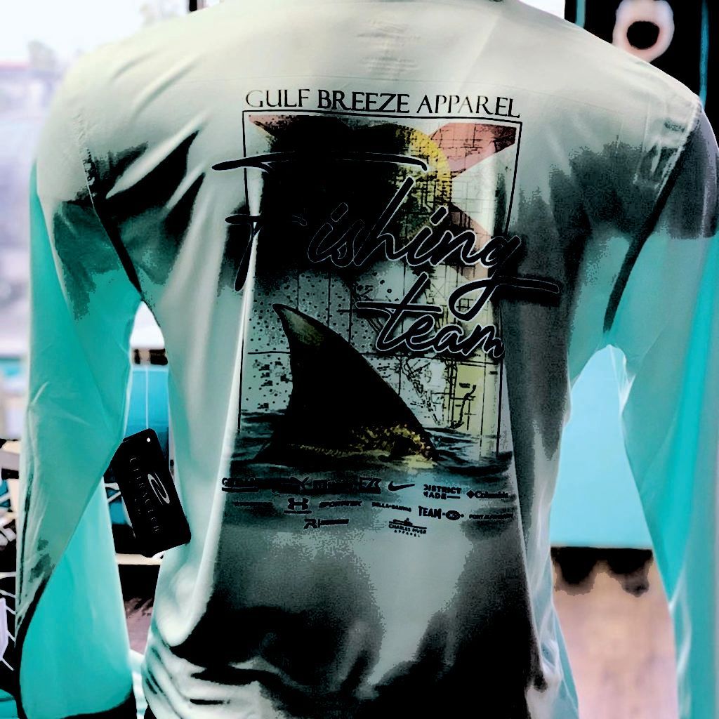 Mannequin wearing a mint tie-dye graphic T-shirt with a large shark print on the back