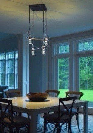 Modern light fixture over dining room table
