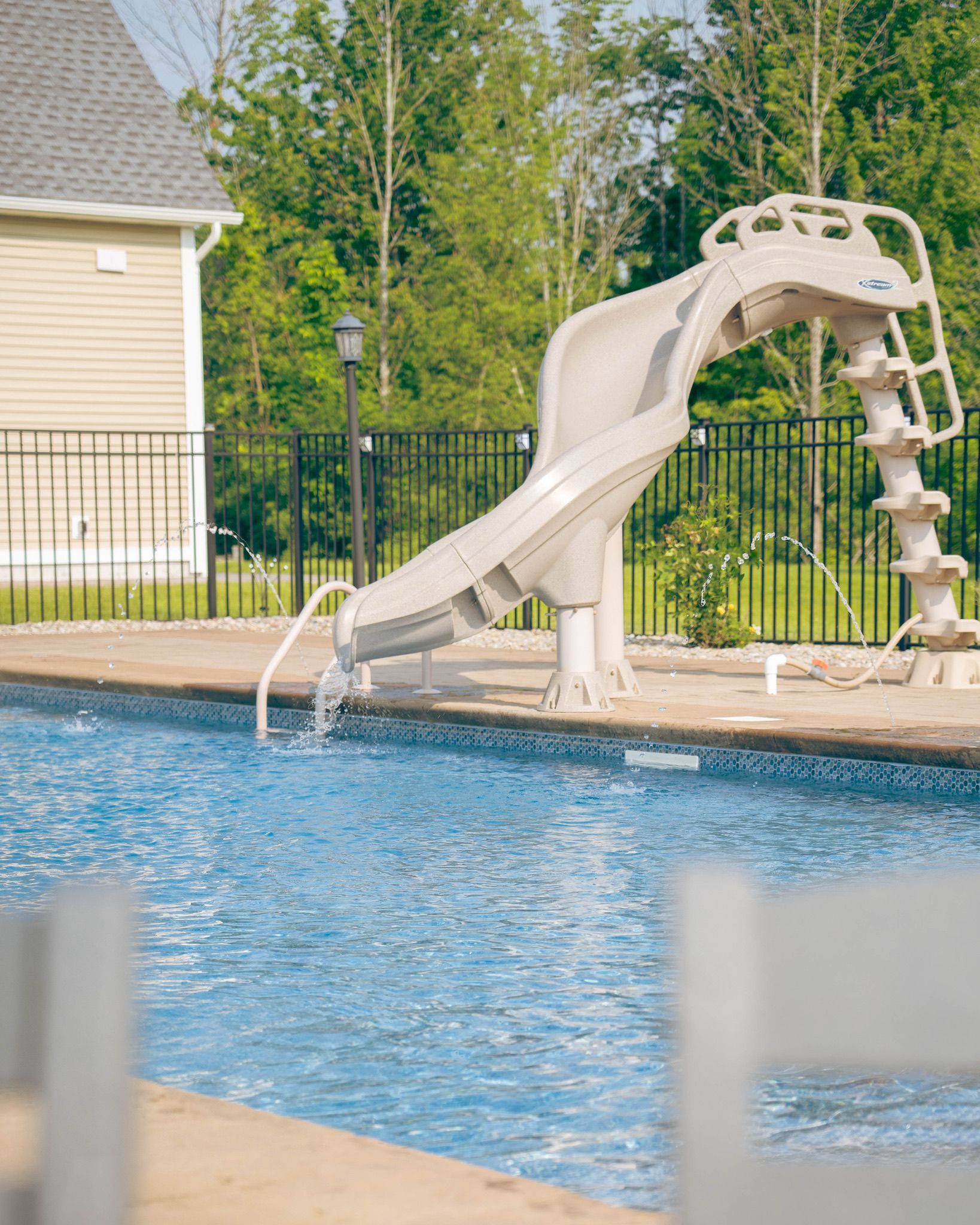 Swimming pool with a water slide.