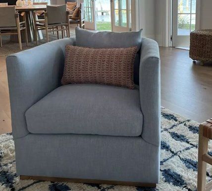Gray sofa with a tiny throw pillow