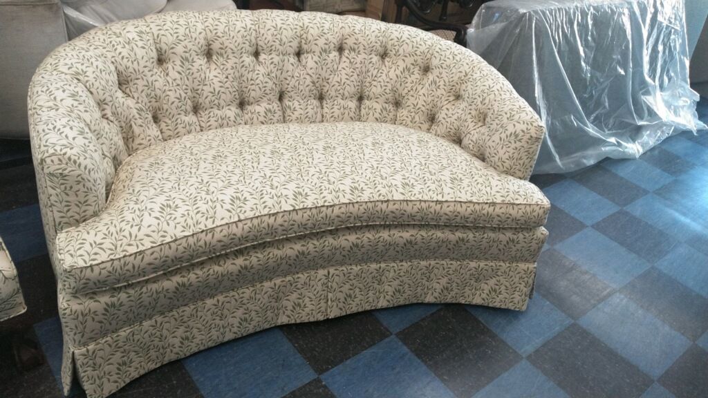A newly upholstered curved couch