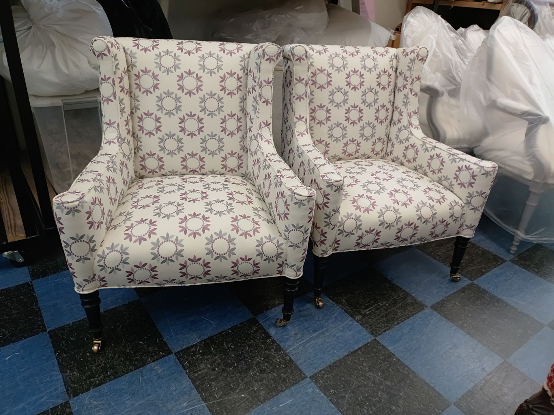 Two chairs are sitting on a checkered floor