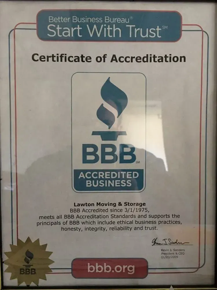 Framed BBB certificate of accreditation for Liwan Moving & Storage. Contains BBB logo and accreditation details.