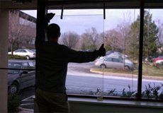 Man removing old window