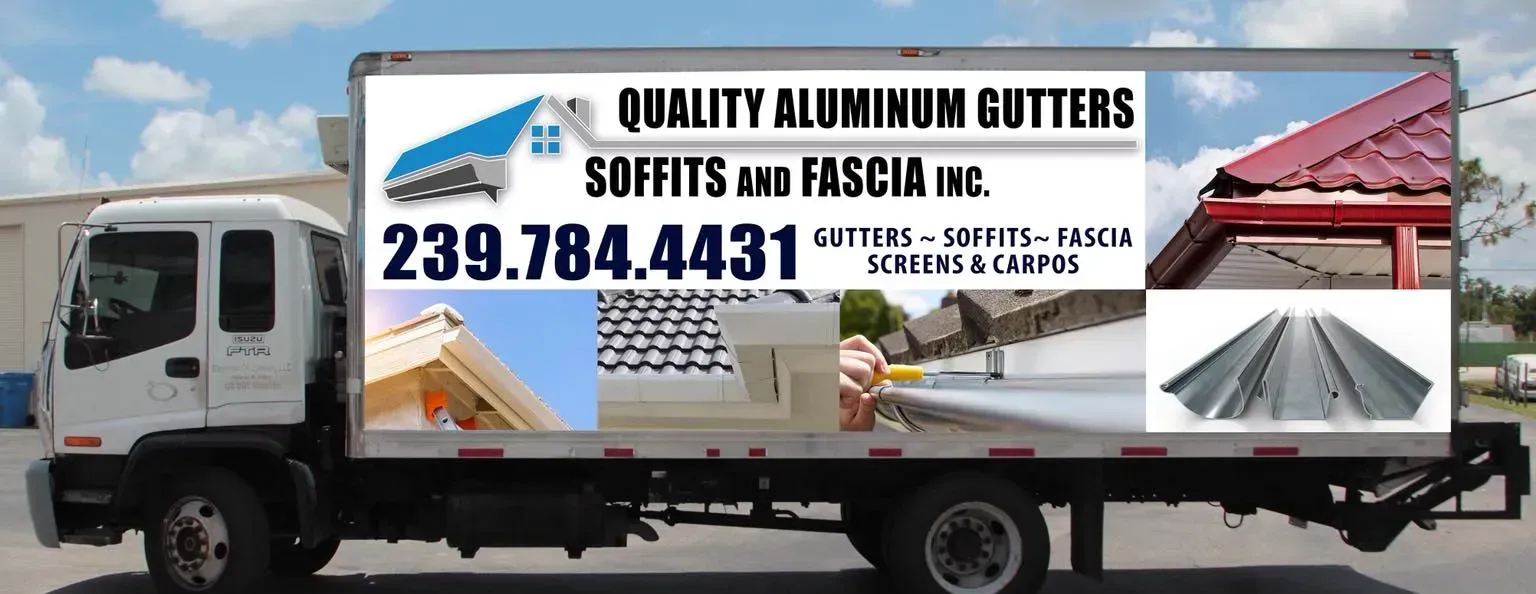 White truck with a billboard for quality aluminum gutters and soffits in Escanaba, with phone number 239.784.4431