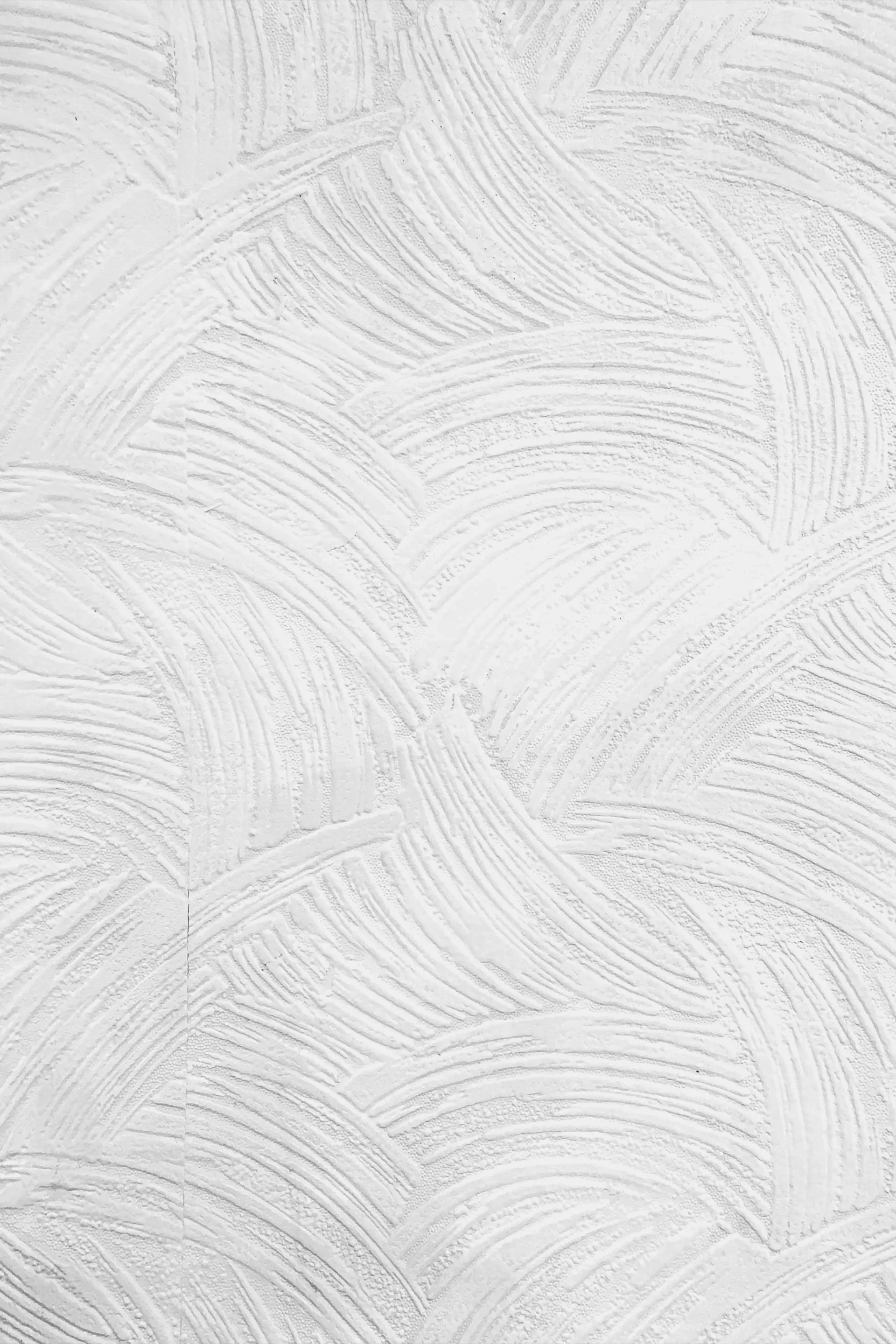 Light gray textured wall with a subtle brushed pattern