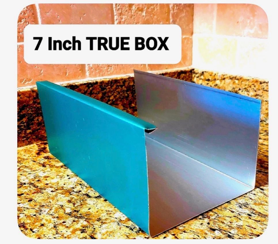 Teal and silver metal box on granite countertop labeled “7 Inch TRUE BOX”