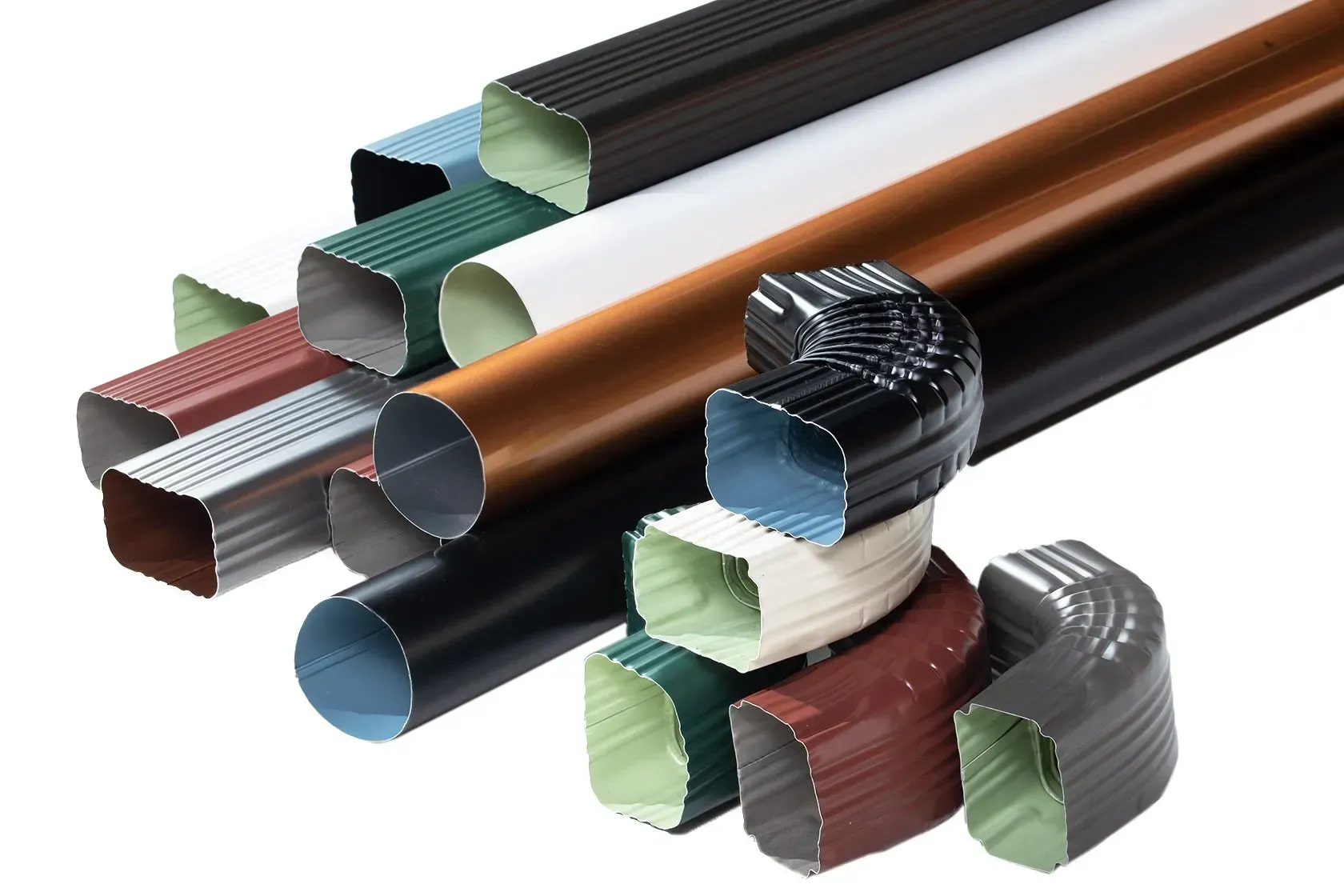Stacked metal and plastic extrusions in white, copper, black, green, and gray, shown in close-up.