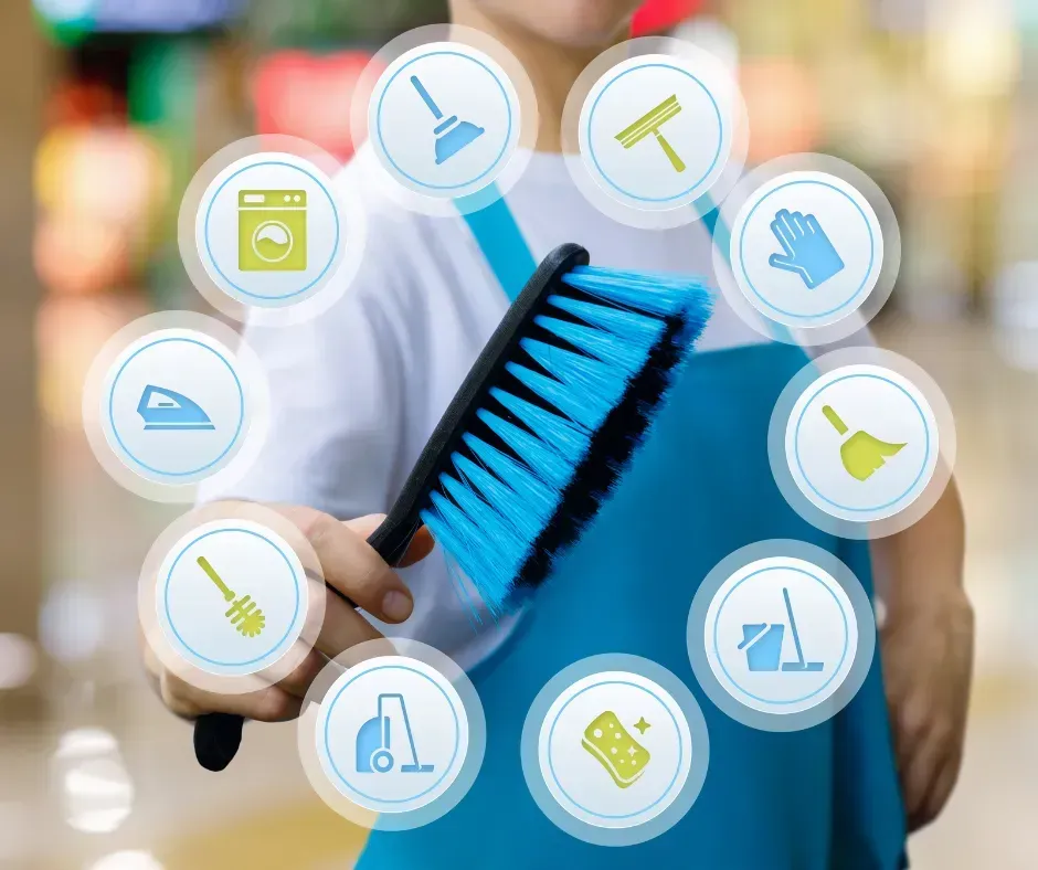 Person holding blue cleaning brush with floating household cleaning icons around it