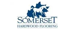 The logo for somerset hardwood flooring has a horse on it.