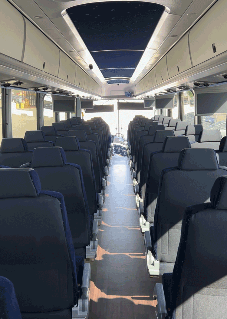 MCI charter bus rental interior, view from the rear